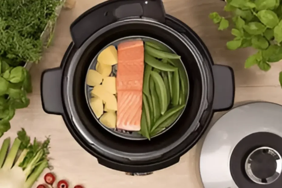 Legumes sendo feito em uma panela elétrica de arroz.